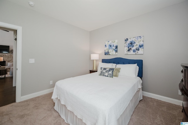 3104 Simms Lndg, Pelham, AL 35124 - bedroom with baseboards, carpet flooring, and a brick fireplace