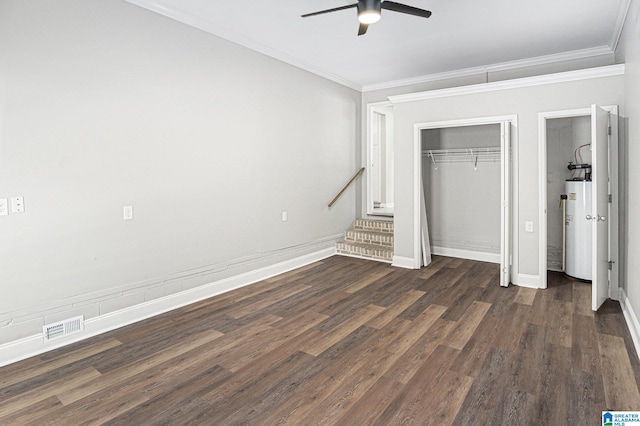 6365 Pocahontas Rd, Bessemer, AL 35022 - unfurnished bedroom featuring water heater, ornamental molding, dark wood-type flooring, a closet, and ceiling fan