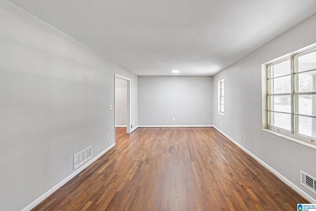 6365 Pocahontas Rd, Bessemer, AL 35022 - spare room featuring dark wood finished floors and baseboards