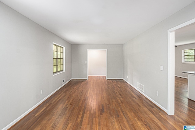 6365 Pocahontas Rd, Bessemer, AL 35022 - empty room with dark wood finished floors and baseboards