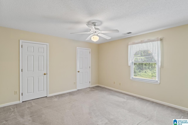 2009 Creely Cir, Birmingham, AL 35235 - unfurnished bedroom featuring carpet, a textured ceiling, baseboards, and ceiling fan