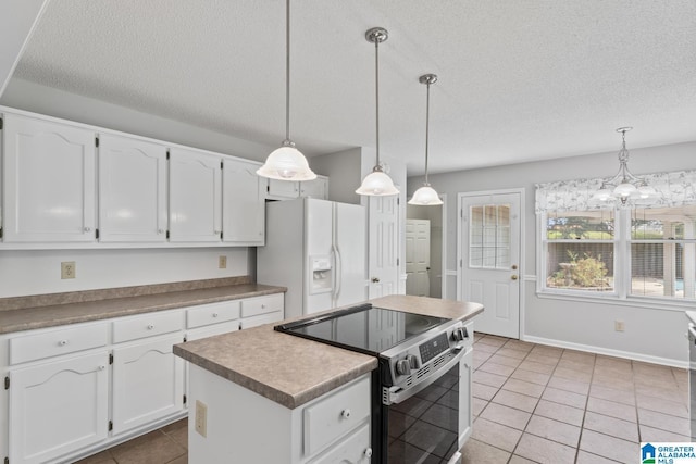 2009 Creely Cir, Birmingham, AL 35235 - kitchen featuring electric range oven, white fridge with ice dispenser, a textured ceiling, white cabinetry, and light tile patterned floors