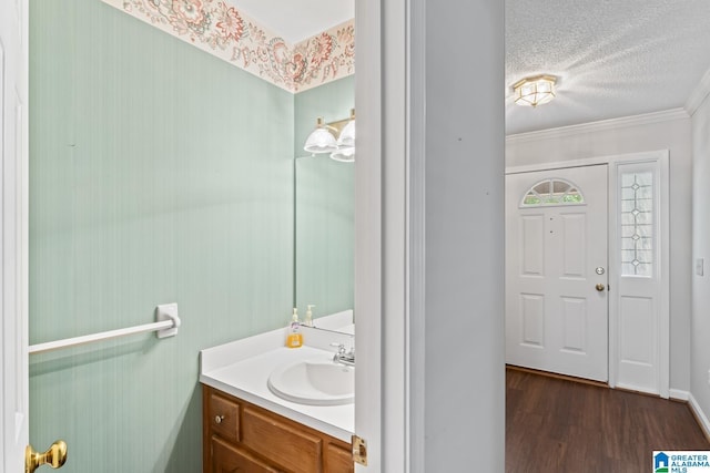 2009 Creely Cir, Birmingham, AL 35235 - bathroom with vanity, wood finished floors, a textured ceiling, and crown molding