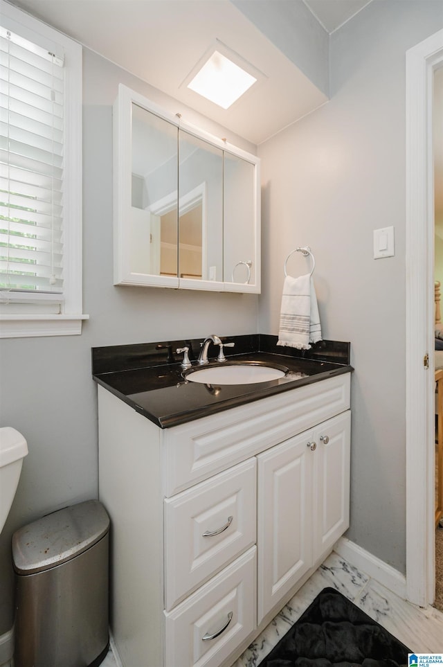 4669 Burning Tree Ln, Pelham, AL 35124 - bathroom featuring vanity, toilet, and marble finish flooring
