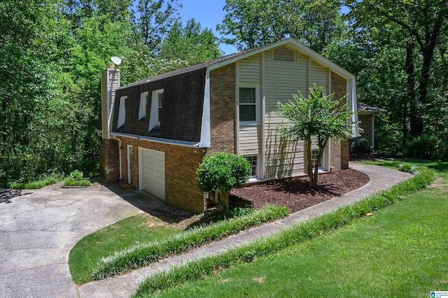 4669 Burning Tree Ln, Pelham, AL 35124 - view of home's exterior featuring driveway, brick siding, a chimney, a garage, and a shingled roof