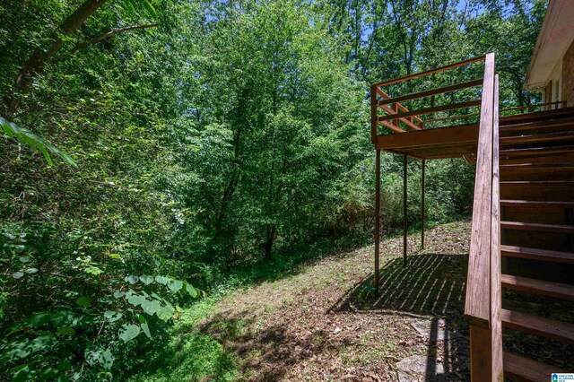 4669 Burning Tree Ln, Pelham, AL 35124 - view of yard with stairway and a wooden deck