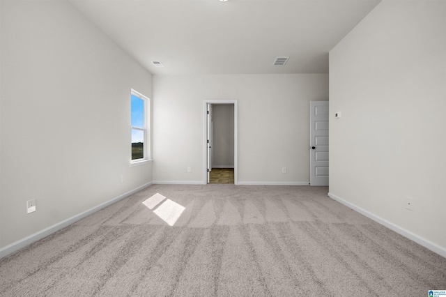 2017 Valley Run, Leeds, AL 35094 - unfurnished bedroom with light colored carpet, baseboards, and a walk in closet