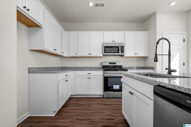 2017 Valley Run, Leeds, AL 35094 - kitchen with stainless steel appliances, a sink, light stone counters, recessed lighting, and white cabinetry