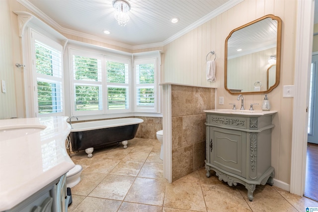 95 River Oaks Ln, Cropwell, AL 35054 - bathroom featuring vanity, crown molding, a freestanding bath, and toilet