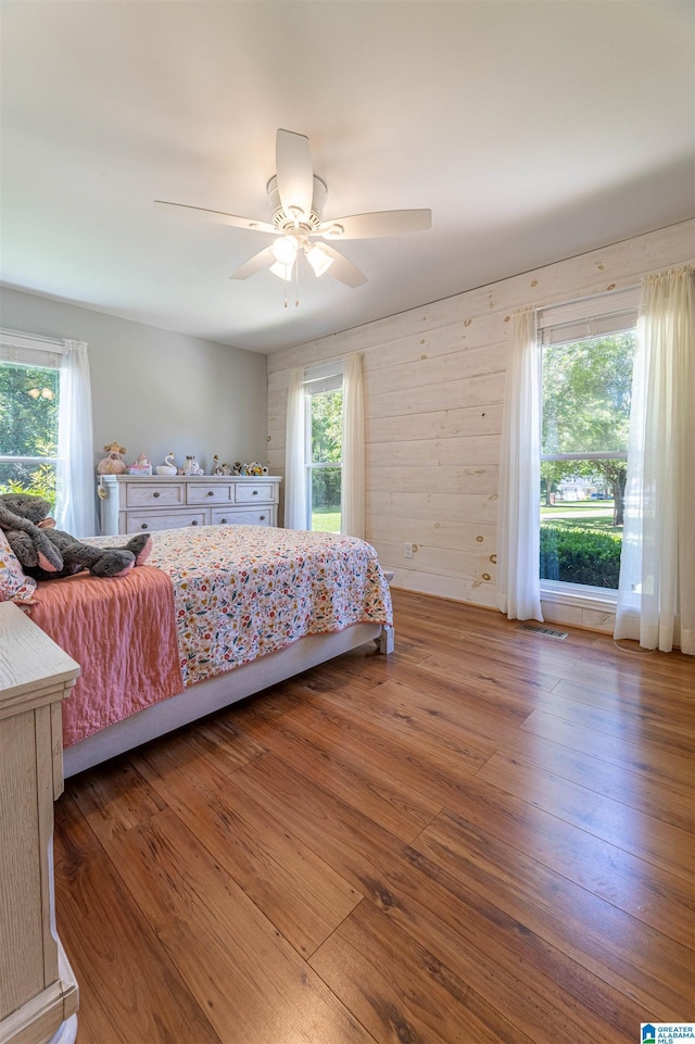 95 River Oaks Ln, Cropwell, AL 35054 - bedroom with multiple windows, a ceiling fan, and wood finished floors