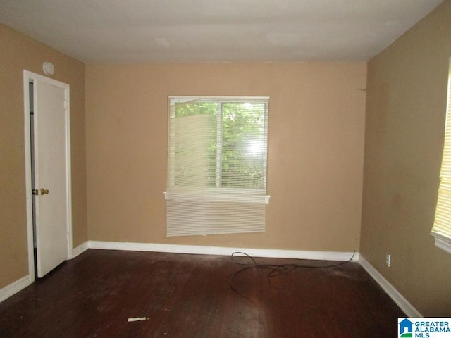 1782 49th St, Birmingham, AL 35208 - spare room with dark wood-type flooring and baseboards