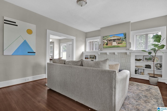 living area featuring dark wood-style floors and baseboards