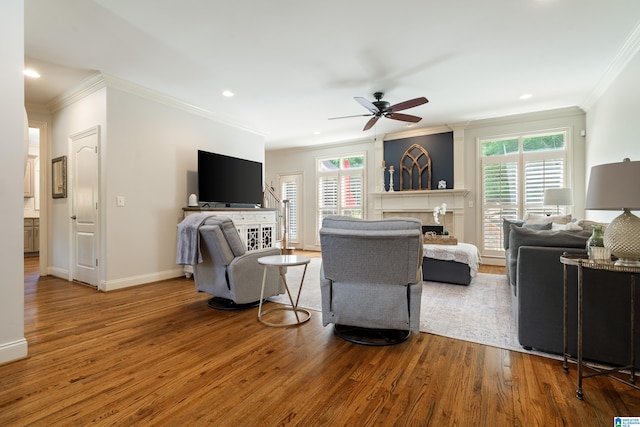 1048 Eagle Hollow Dr, Birmingham, AL 35242 - living area featuring ornamental molding, a fireplace, wood finished floors, a ceiling fan, and baseboards