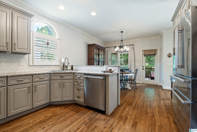 1048 Eagle Hollow Dr, Birmingham, AL 35242 - kitchen with stainless steel appliances, gray cabinetry, dark wood-style floors, a peninsula, and a sink