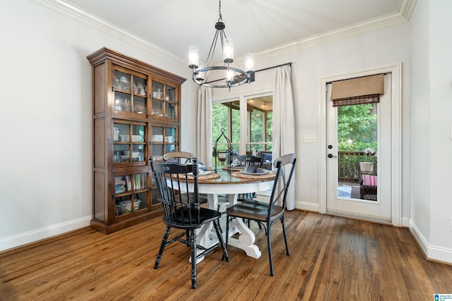 1048 Eagle Hollow Dr, Birmingham, AL 35242 - dining area featuring a chandelier, baseboards, wood finished floors, and ornamental molding