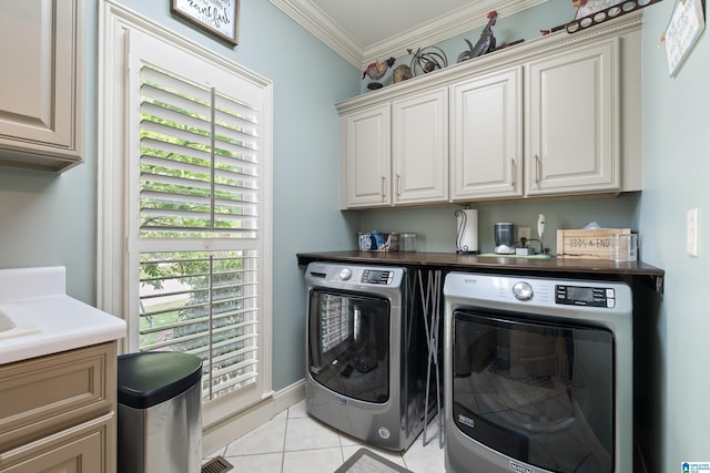 1048 Eagle Hollow Dr, Birmingham, AL 35242 - washroom featuring washing machine and clothes dryer, cabinet space, light tile patterned floors, and ornamental molding
