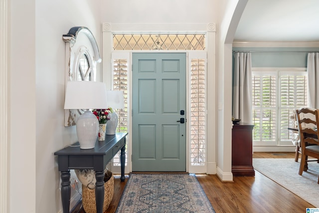 1048 Eagle Hollow Dr, Birmingham, AL 35242 - foyer entrance with arched walkways, baseboards, wood finished floors, and crown molding