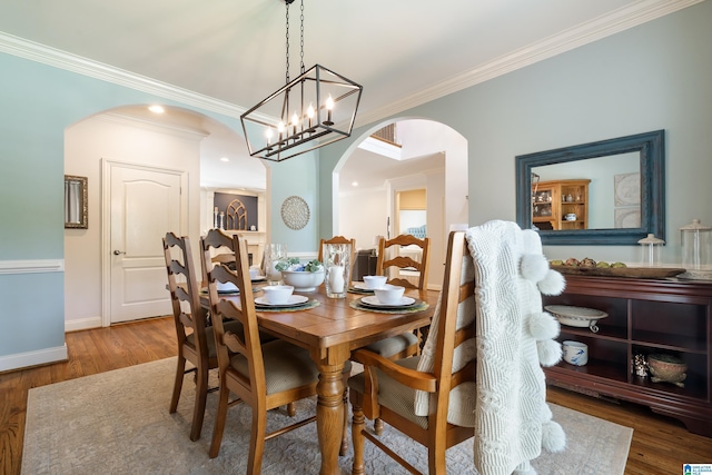 1048 Eagle Hollow Dr, Birmingham, AL 35242 - dining room with arched walkways, wood finished floors, crown molding, and baseboards