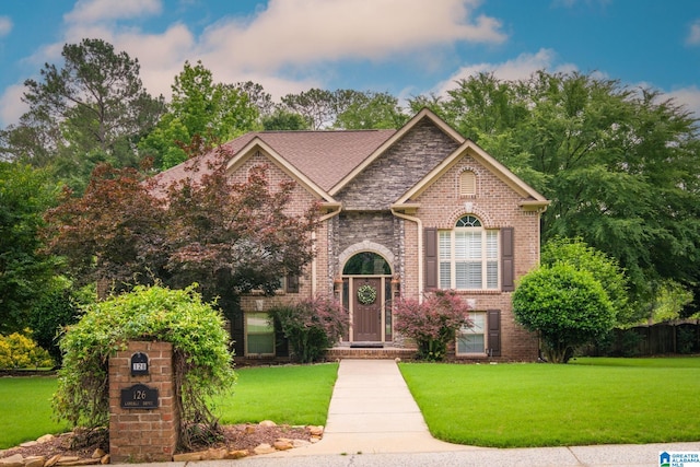 126 Landale Dr, Sterrett, AL 35147 - view of front facade with brick siding and a front yard