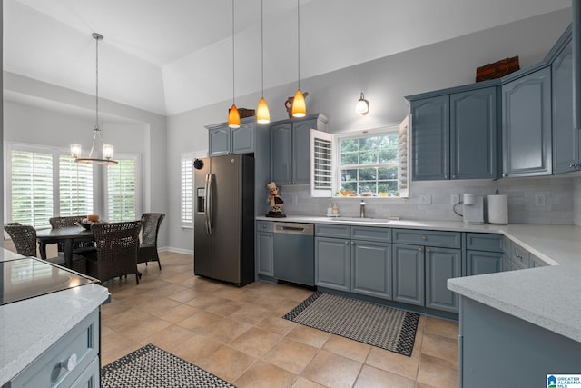 126 Landale Dr, Sterrett, AL 35147 - kitchen featuring appliances with stainless steel finishes, a sink, backsplash, a chandelier, and decorative light fixtures