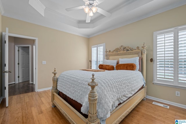 126 Landale Dr, Sterrett, AL 35147 - bedroom featuring light wood finished floors, a raised ceiling, baseboards, and ornamental molding