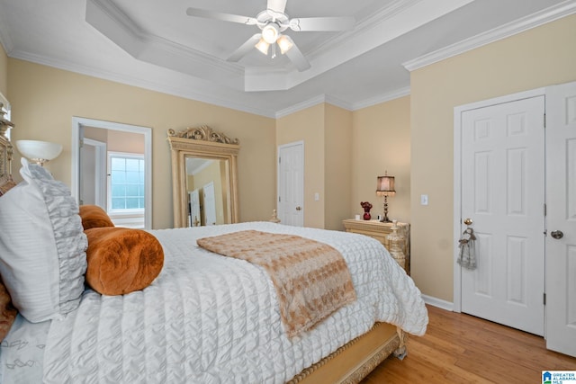 126 Landale Dr, Sterrett, AL 35147 - bedroom featuring ornamental molding, wood finished floors, a tray ceiling, and a ceiling fan