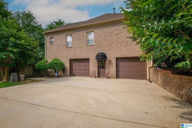 126 Landale Dr, Sterrett, AL 35147 - view of front facade featuring concrete driveway, brick siding, and an attached garage