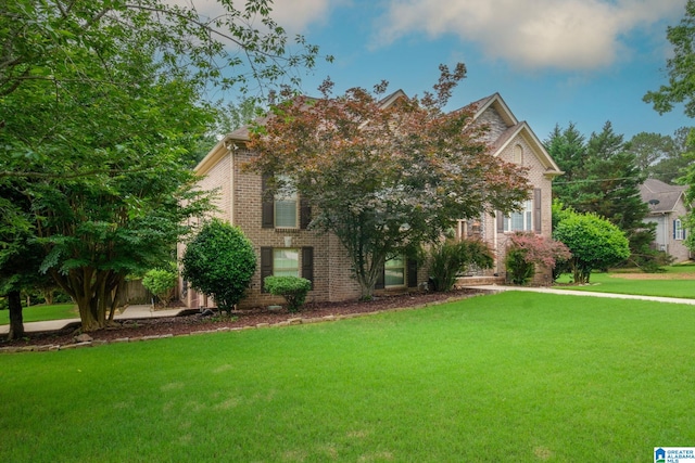 126 Landale Dr, Sterrett, AL 35147 - obstructed view of property with brick siding and a front yard