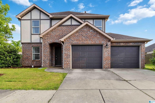 22873 Downing Park Cir, Mccalla, AL 35111 - view of front of house with driveway, brick siding, a garage, a front yard, and stucco siding