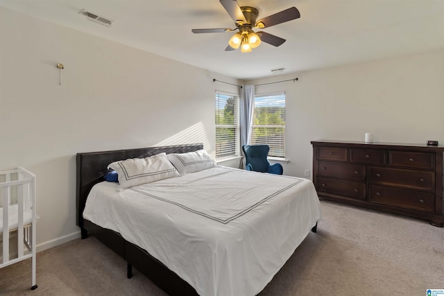 22873 Downing Park Cir, Mccalla, AL 35111 - bedroom with light carpet, baseboards, and a ceiling fan