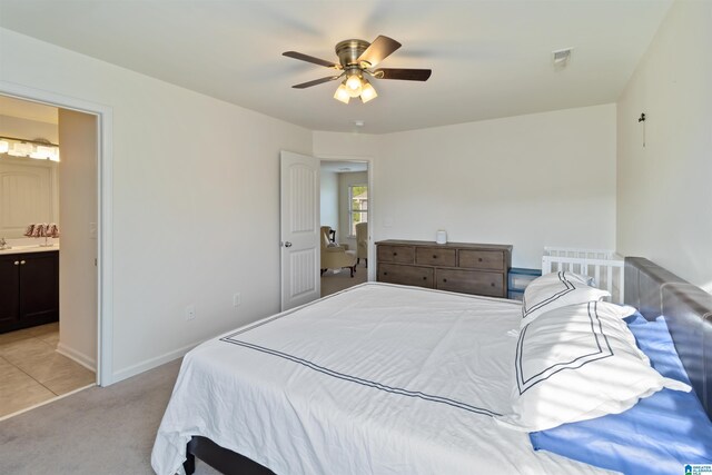 22873 Downing Park Cir, Mccalla, AL 35111 - bedroom featuring light carpet, connected bathroom, a ceiling fan, and baseboards