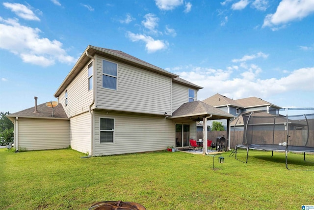 22873 Downing Park Cir, Mccalla, AL 35111 - back of property with a trampoline, a patio, and a fire pit