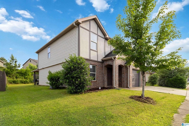 22873 Downing Park Cir, Mccalla, AL 35111 - english style home with driveway, brick siding, a front yard, and an attached garage
