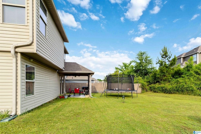 22873 Downing Park Cir, Mccalla, AL 35111 - view of yard featuring a trampoline and a patio