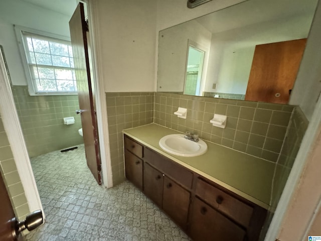 2270 Smithfield Ln N, Birmingham, AL 35207 - bathroom featuring tile walls, vanity, a wainscoted wall, and toilet