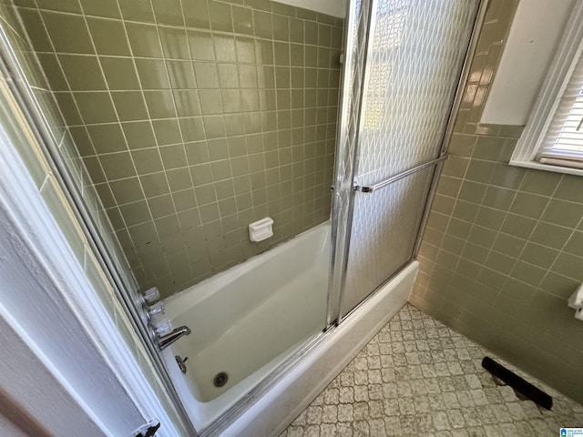2270 Smithfield Ln N, Birmingham, AL 35207 - bathroom featuring shower / bath combination with glass door and tile walls