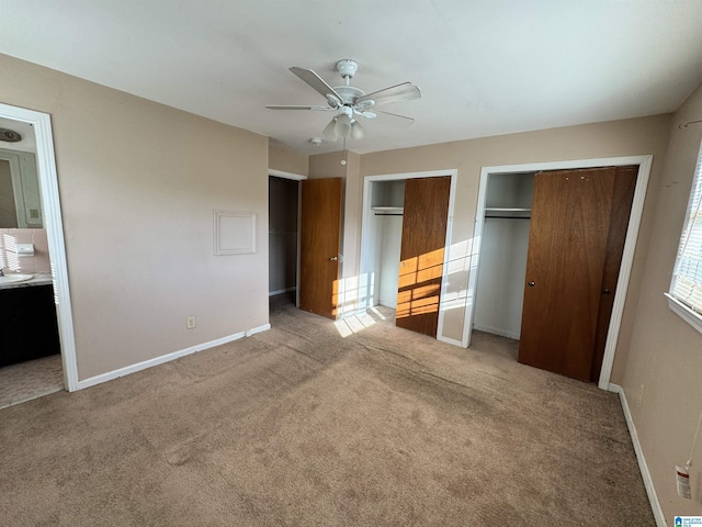 2270 Smithfield Ln N, Birmingham, AL 35207 - unfurnished bedroom with two closets, carpet flooring, baseboards, ensuite bathroom, and ceiling fan