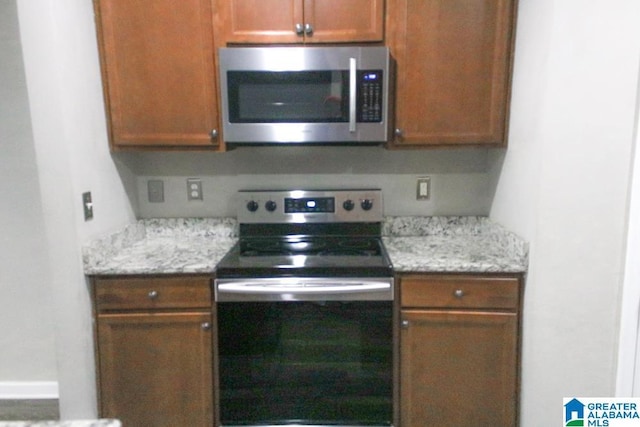 4905 Stonecreek Way, Calera, AL 35040 - kitchen with appliances with stainless steel finishes and brown cabinets