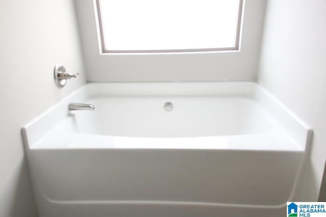 4905 Stonecreek Way, Calera, AL 35040 - full bathroom with healthy amount of natural light and a tub to relax in