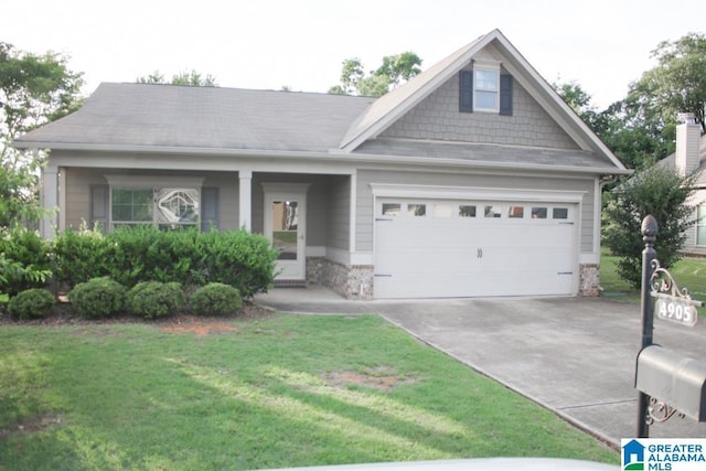 4905 Stonecreek Way, Calera, AL 35040 - view of front facade featuring an attached garage, concrete driveway, and a front lawn