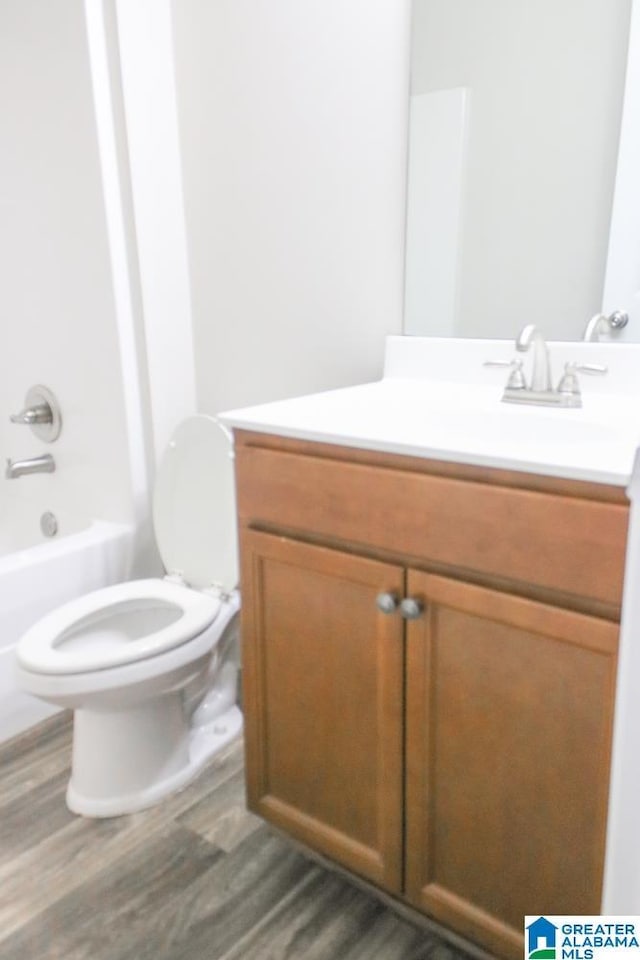 4905 Stonecreek Way, Calera, AL 35040 - full bath with wood finished floors, toilet, vanity, and tub / shower combination