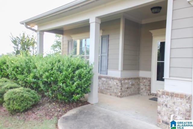 4905 Stonecreek Way, Calera, AL 35040 - doorway to property featuring brick siding and covered porch