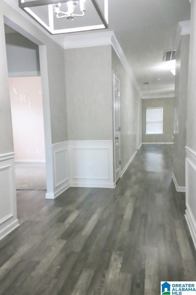 4905 Stonecreek Way, Calera, AL 35040 - corridor featuring ornamental molding, a chandelier, dark wood-style floors, and a wainscoted wall