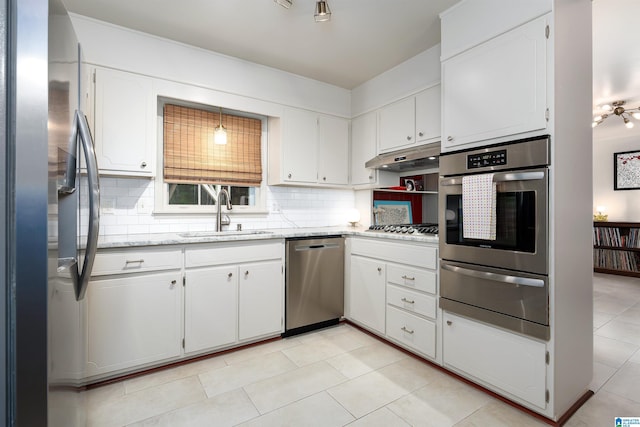 400 Art Hanes Blvd, Birmingham, AL 35213 - kitchen featuring appliances with stainless steel finishes, a sink, a warming drawer, and decorative backsplash