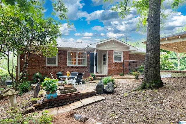 400 Art Hanes Blvd, Birmingham, AL 35213 - back of property with brick siding and a patio area
