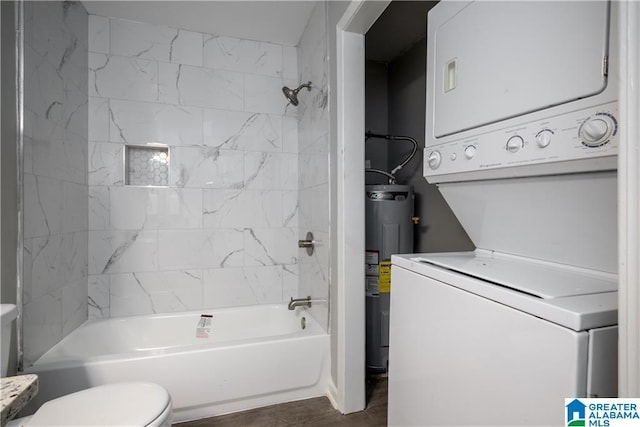 1721 Hackberry Ln Unit 6, Tuscaloosa, AL 35401 - full bath featuring stacked washer / drying machine, water heater, tub / shower combination, and wood finished floors