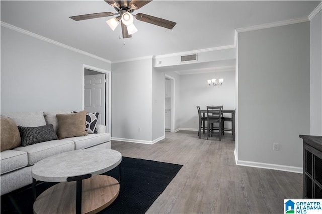 1721 Hackberry Ln Unit 6, Tuscaloosa, AL 35401 - living area featuring wood finished floors, a ceiling fan, a chandelier, and crown molding