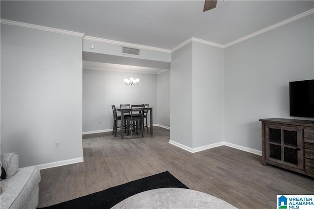 1721 Hackberry Ln Unit 6, Tuscaloosa, AL 35401 - living area with wood finished floors, a chandelier, a ceiling fan, and crown molding