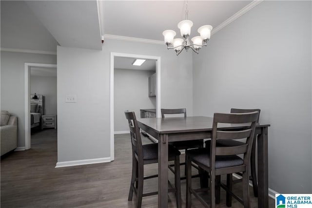 1721 Hackberry Ln Unit 6, Tuscaloosa, AL 35401 - dining area with crown molding, dark wood-style floors, and a chandelier