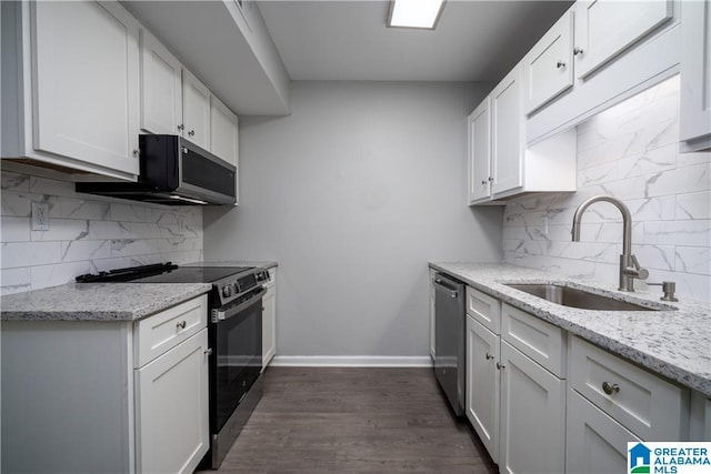 1721 Hackberry Ln Unit 6, Tuscaloosa, AL 35401 - kitchen with stainless steel appliances, decorative backsplash, light stone counters, and white cabinets